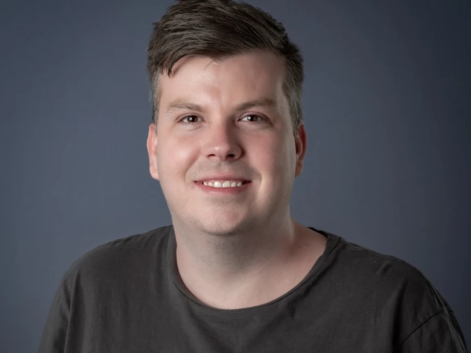 Professional portrait of Ash Sexberg
